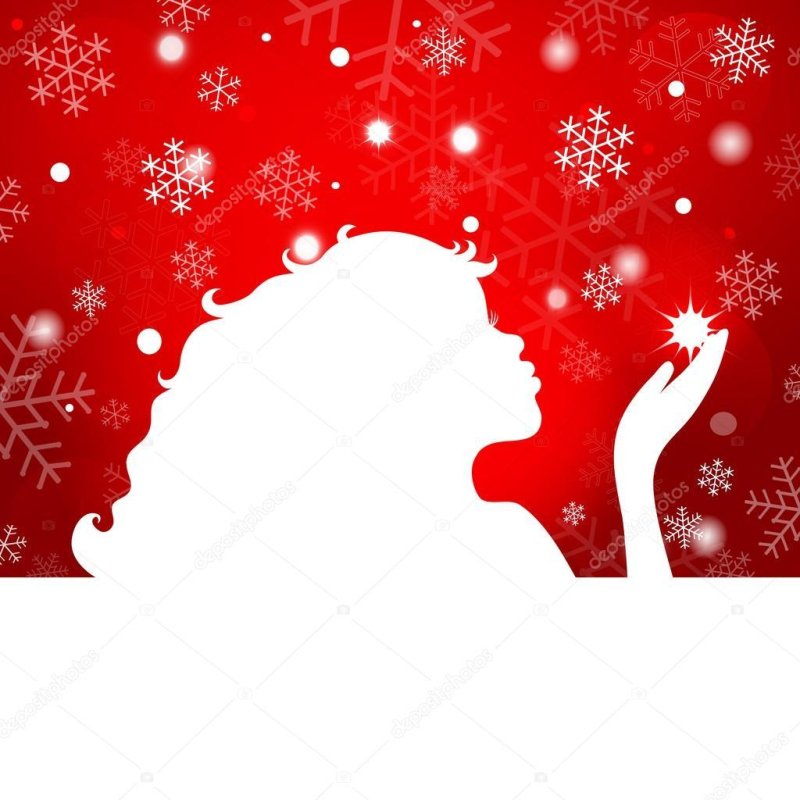 Женщина дует снежинки