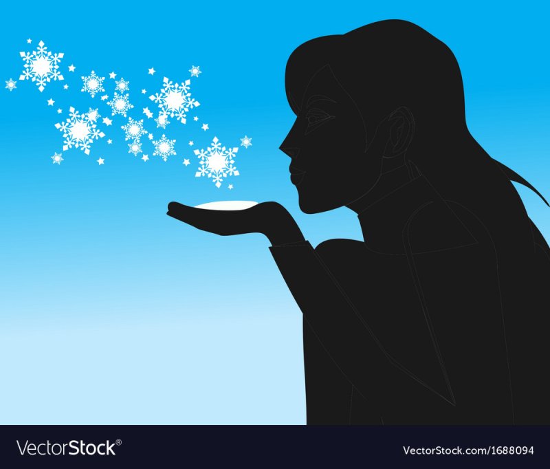 Девушка дует снежинки