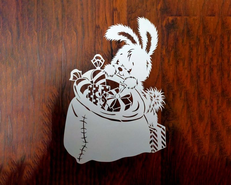 Новогодние вырезалки на окна зайцы