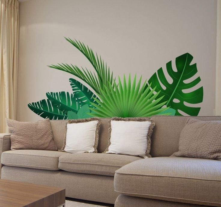 Листья на стене в интерьере тропические