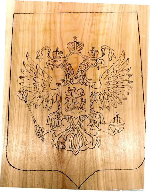 Символ выжженный на дереве